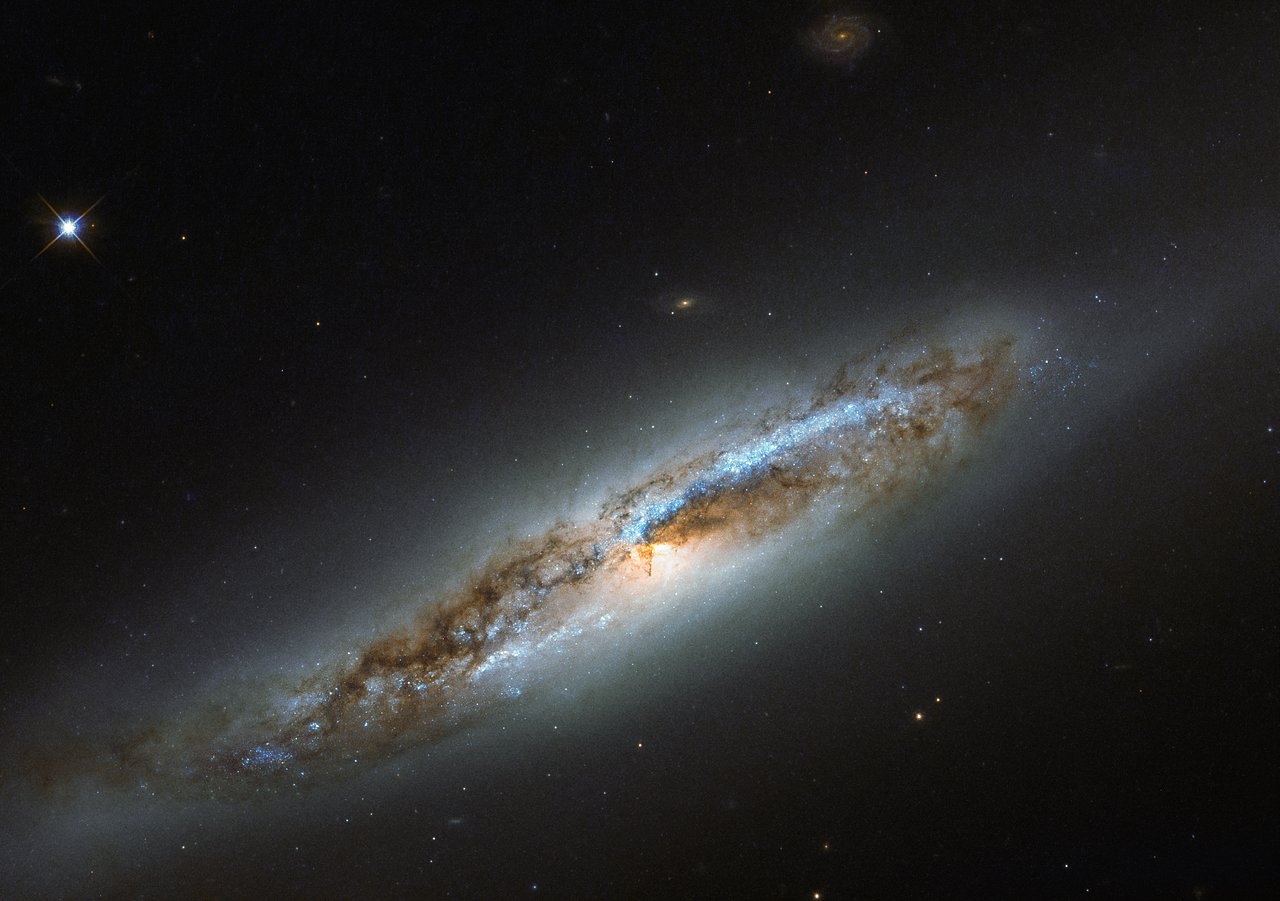 The Lopsided Galaxy: Hubble Catches NGC 4654 Squeezed on One Side, Stripped on the Other