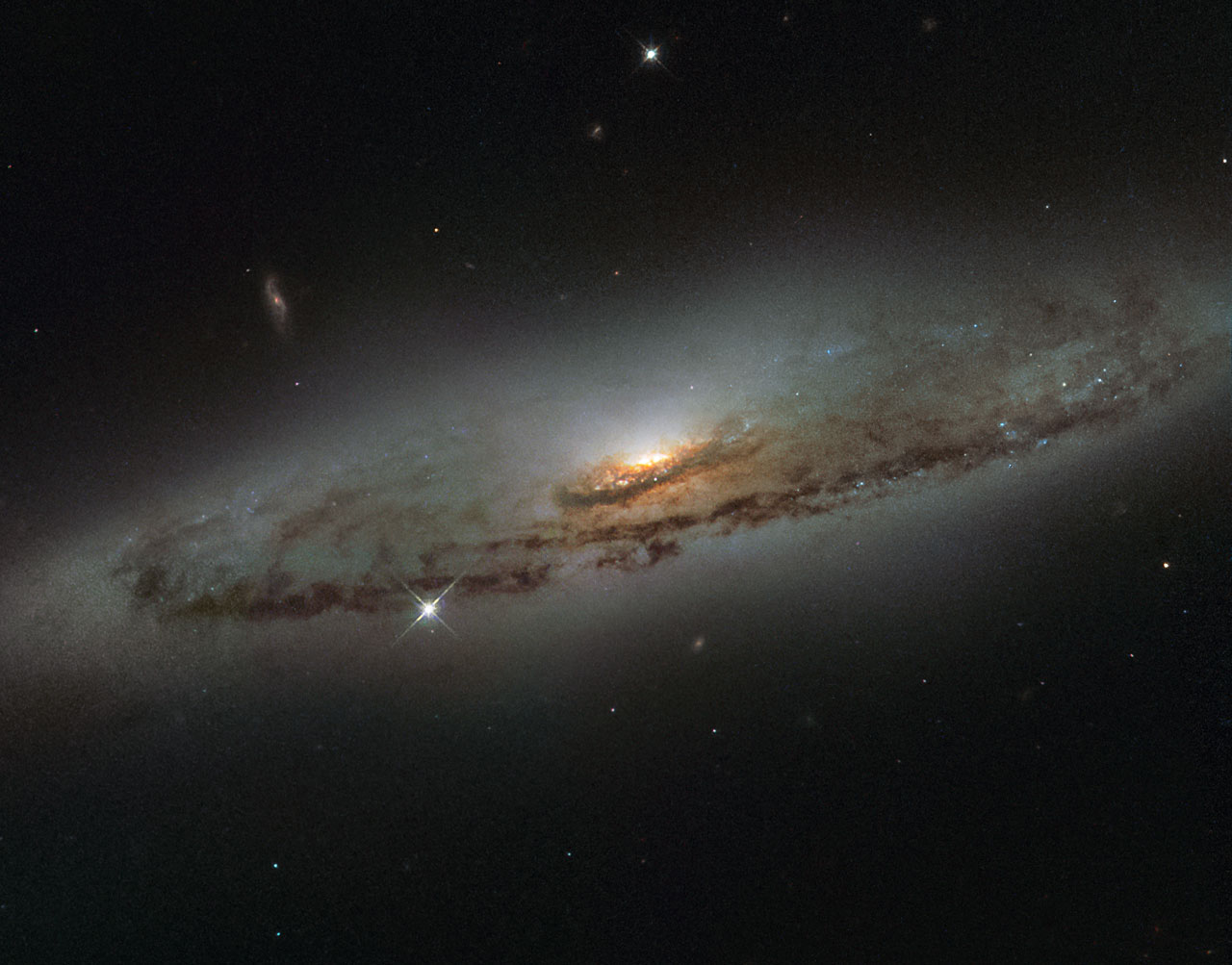 Hubble's Out-of-Sync Galaxy: NGC 4698 and the Bulge That Turned 90 Degrees